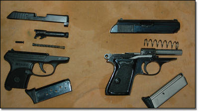 Both, disassembled. The Ruger, right, has the separate, floating barrel design that sits with the slide. The PPK to the left has the barrel integral to the frame.