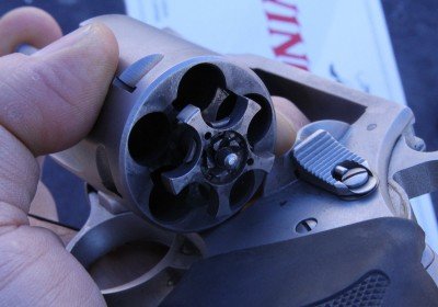 Look inside the cylinders and you will see the little springloaded nubs that hold in the .40S&W rounds. This gun ran all day at Media Day at the Range, SHOT Show 2012, and was filthy as you can see, yet ran and ran with no cleaning.