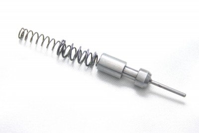 The firing pin is a simple cylindrical piece powered by double-nested springs.