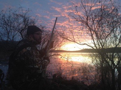 An Arkansas sunrise from the duck blind with the Mossberg Duck Commander 930 in hand. Photo by Denis Dunderdale