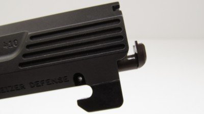 Heizer Defense PS1 Pocket Shotgun Pistol – New Gun Review The spring loaded extractor easily lifts spent hulls and brass from the chamber. The massive under-barrel locking lug locks the barrel to the frame when firing.)