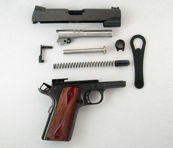 The gun is easily field stripped for cleaning either with the supplied bushing wrench or without. The parts in order are the slide, barrel, slide stop, guide rod, barrel bushing, bushing wrench, recoil spring, recoil spring plug, and receiver assembly.