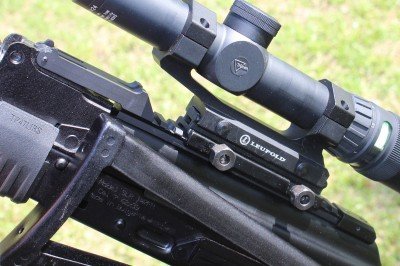 The front pin acts as a hinge for the whole rail, which pivots up off the dust cover, allowing full access to the inside of the receiver.  