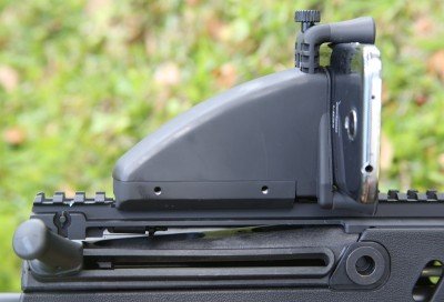 This is the other side of the InteliSCOPE, mounted on an IWI Tavor. In this position the bolt handle bumped your hand on the phone. 