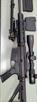 A DPMS LR-308 in Excellent condition with 3-12X44 scope and bi-pod