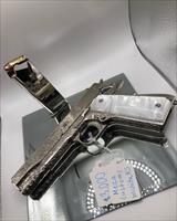 Springfield 1911 Full Engraved and High Polished Bright Nickel Plated.