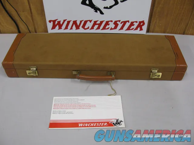 7809  Winchester 23 Golden Quail 410 ga 26 inch barrels mod/full straight grip, ejectors,solid  rib,quail and dog engraved on coin silver receiver, Winchester butt pad, all original, Winchester case and pamplet, 99% condition,opens closes t
