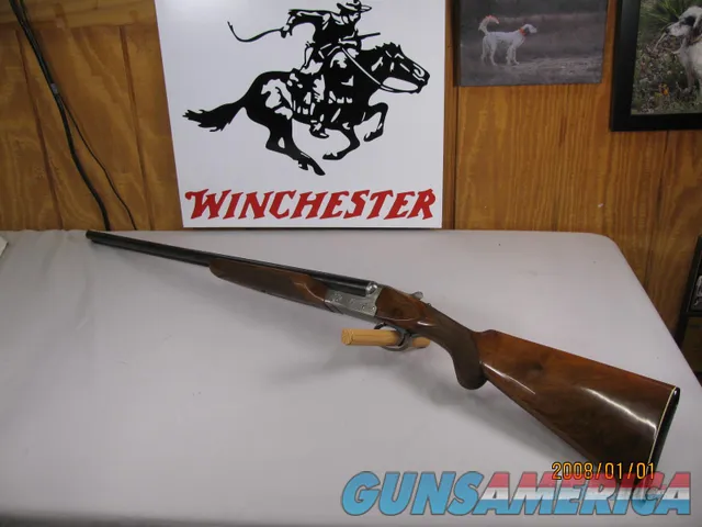 7850  Winchester 23 Pigeon XTR 20 gauge 26 inch barrels 2 3/4&3 inch chambers, ic/mod, round knob, vent rib, ejectors, Winchester butt plate, rose and scroll coin silver engraved receiver, opens closes tight, bores bright shiny, 2 white bea