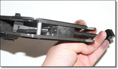 Pictures are very difficult to capture the bolt mechanism of the KRISS. This picture is from the top looking down, parallel to the travel of the bolt. That spring squishes at the bottom of the handle. You can see the bolt just turning the corner to downwards here. Pictures are very difficult to capture the bolt mechanism of the KRISS. This picture is from the top looking down, parallel to the travel of the bolt. That spring squishes at the bottom of the handle. You can see the bolt just turning the corner to downwards here.