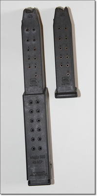 The KRISS takes standard G21 mags, and it comes with two of these extensions for the 30 round variety made by KRISS. My gun came with the mags attached but I don't know what they are shipping with. 