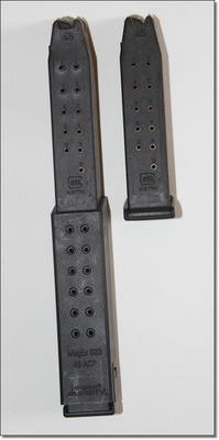 The KRISS takes standard G21 mags, and it comes with two of these extensions for the 30 round variety made by KRISS. My gun came with the mags attached but I don't know what they are shipping with. The KRISS takes standard G21 mags, and it comes with two of these extensions for the 30 round variety made by KRISS. My gun came with the mags attached but I don't know what they are shipping with.