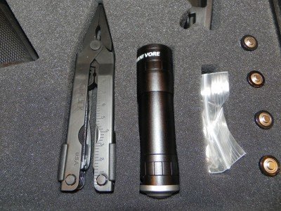 In addition to a multi- tool and flashlight, the ESK has four spare AA batteries.
