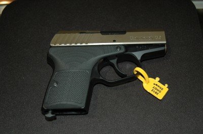 photo 4 (1) Different finished are available for the R-9. This is a greenish tinted metal treatment.