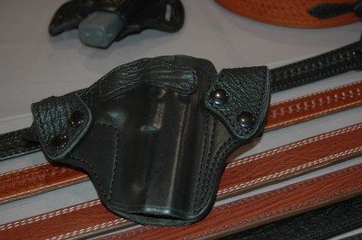 The new sharkskin / leather combination holsters: open top, in both black and brown. Give your gun something classy to ride in.