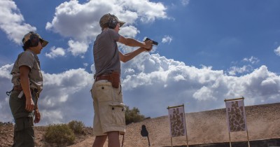 This handgun shooter is employing an almost perfect Weaver stance. By working one-on-one with an instructor, students can have time to work with various positions in order to find one that best suits them.