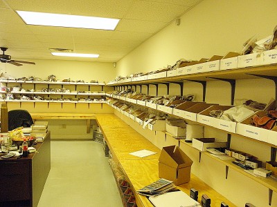 : Each box contains a different model of holsters, sometimes two. This is about half of their holster fulfillment room.