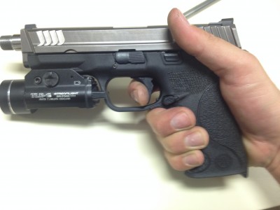 Apex Tactical's S&W M&P Trigger Replacement Finger resting on trigger before pressing