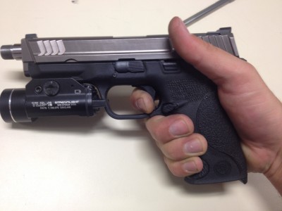 Apex Tactical's S&W M&P Trigger Replacement Author depresses trigger all the way to the rear. Almost a half inch less travel than the stock trigger assembly.