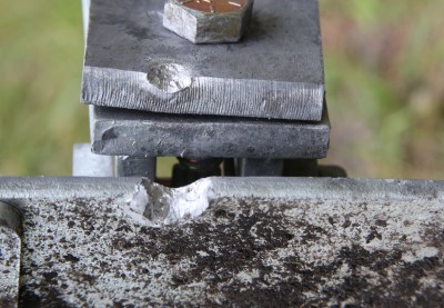 Grizzly Targets Trifecta Torture Test - Range Report Test-other – Even this ricochet off of the bottom of the paddle took a chunk out of the base.