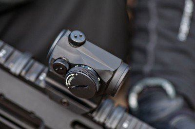 Aimpoint Micro H-1 Review View of Aimpoint H-1 windage and elevation as well as the brightness adjustment knob.