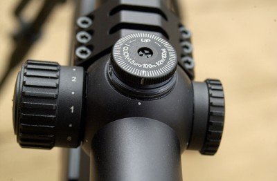 The adjustment knobs for zeroing the reticle are on the top and right hand side. No tool is necessary to adjust them. Once the scope is zeroed to your satisfaction, press the adjustment knob in and turn it so that the hash mark lines up with the dot on the scope body. Then you can make adjustments as the situation dictates and easily return to your original zero.
