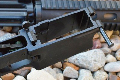 The mag well accepts steel, aluminum, and polymer magazines. 