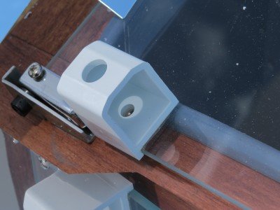 This new version of The Sun Oven comes with two of these centering tools. You turn the oven, raise it and lower it to keep the dot in center of the light showing through. 