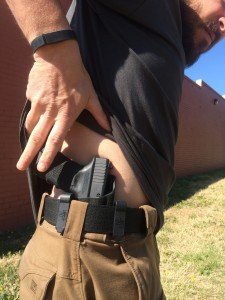 By sweeping backward and getting a thumb under the shirt, the author is able to access the handgun quickly and efficiently. The holster shown is the Haley Strategic Partners INCOG by G-Code. 