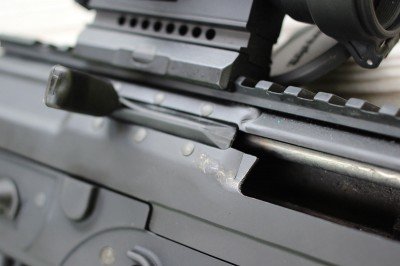 The charging handle on the P556 slides back with the bolt, but it is more easily accessed than an AR’s charging handle.