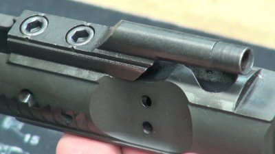 The bolt carrier group is coated for corrosion resistance and lubricity, and the gas key is staked in place.