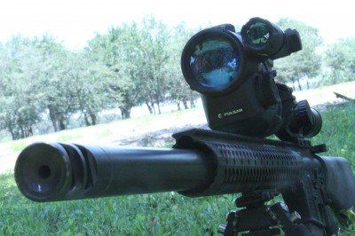 This is the StraightJacket from Teludyne Tech. (it has a night vision attached to the Nikon scope for another article now). The new Sine Pari StraightJacket is better than this Gen3 because they took the gas tube out of the jacket. Expansion of the tube as it heats up was causing the initial shots to walk up on ARs. 