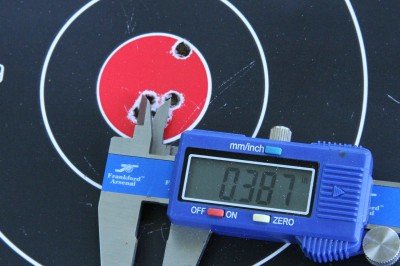 The target on the left in the first picture here is indicative of a lot of groups with this rifle. The 5th shot was a flier. The other 4 were often under 1/2MOA. 