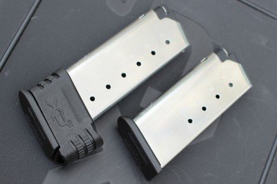 The shorter mag holds five rounds. The other holds seven. 