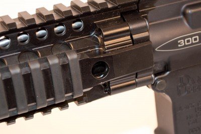 Quick Detach holes are on both sides of the DDM4 rail, front and back.