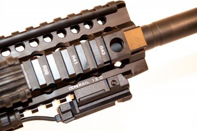 The DDM4 rail, shown here with a LaserMax UNI-MAX ES on the bottom rail with remote activation pad on the right side rail.