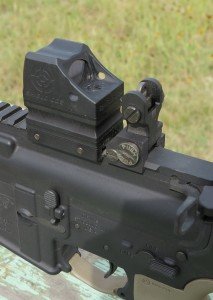 Shield CQS—A Good Red Dot Sight for SBRs The compact aluminum housing of the CQS is no wider than the backup iron sights mounted on this AR15.