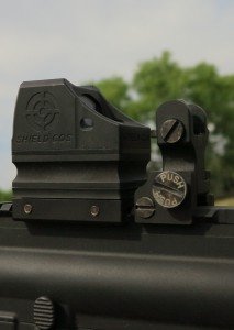 The CQS can be mounted very close to the iron sights, as there is no need to access the rear for battery, power or zero adjustments.