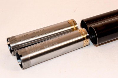 Note the long choke tubes with brass allow sealing rings to prevent gas and residue from getting between the tubes and barrel.