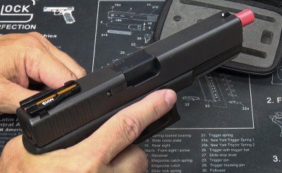 Laser Ammo‘s Training Trifecta: SureStrike Laser, LaserPET and Glock TJ Sight With the red safety nut at the muzzle end, it is easy to see the condition of the handgun.