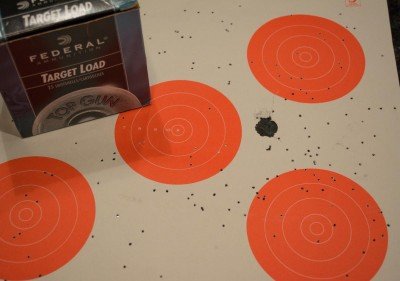 I shot this Federal ⅞ ounce target load of 7 ½ shot from a "3-Gun" distance of 15 yards just to see how the cylinder bore would handle it. The size of the paper target is 14" x 14" for reference.