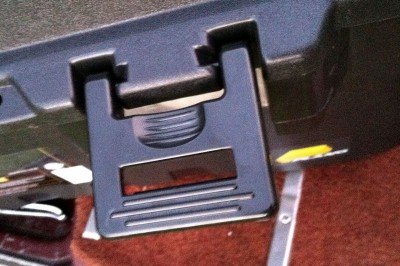 The latches are secure and easy to use.  There are four latches on this size, and no hinges.  The lid pops right off. 