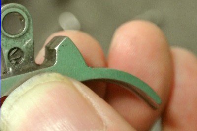 Smooth down where the hammer return spring sets.  This one is rough.
