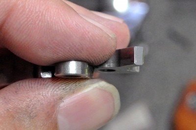 Smooth the two faces that engage the sear, but keep it all square.