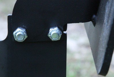 These are the top bolts on the target head where it connects to the portable stand. They are behind the target face.