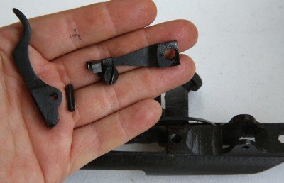 Save these parts! As you can see, the trigger is just a spring and a crossbar. 