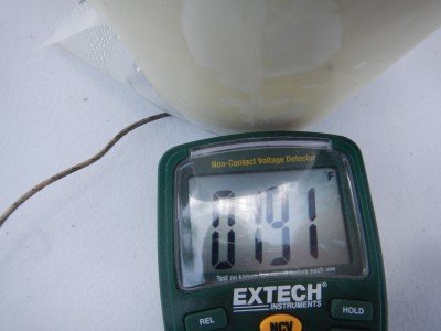 We measured the heater under the bag on a plastic table and it held at almost 200 degrees. 