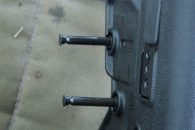 IWI Tavor 5.56/.223 Bullpup Battle Rifle - Solving the Trigger Debacle - Timney Trigger Review These two captured pins can be opened with a shell casing.