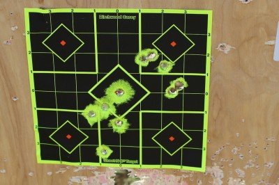 Two magazines from two shooters at 25 yards. The wider yellow spots show that there's not much backing behind the target.