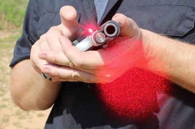 The laser is built into the grip and does a solid job, even in daylight.