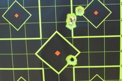 This target shows the shots made with the laser, and then one made from the same location with the irons. All were aimed at the center.